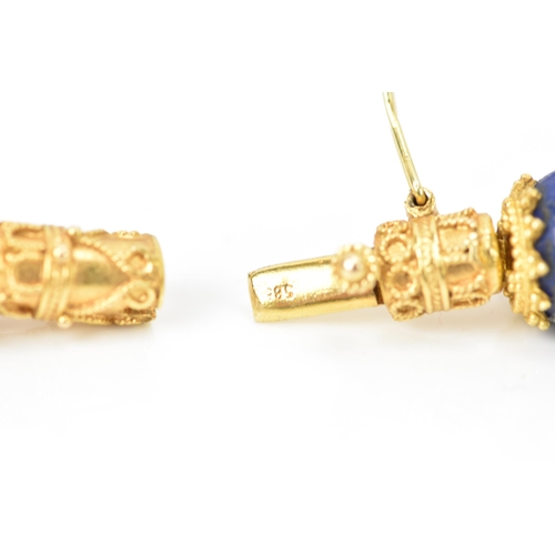 141 - A 14ct yellow gold and lapis lazuli beaded necklace, the rounded beads graduating in size, smallest ... 