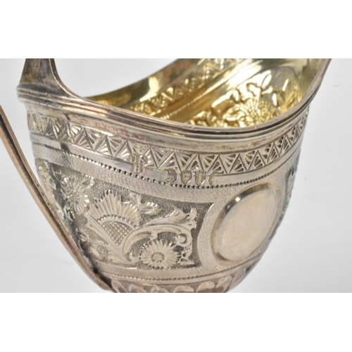 15 - A George III silver milk jug hallmarked London 1810, together with a Victorian silver cream jug hall... 