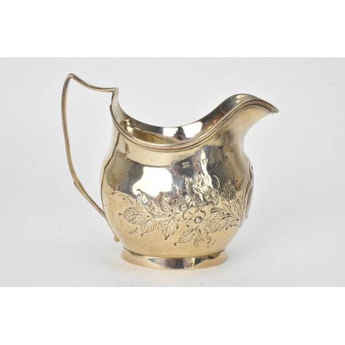 15 - A George III silver milk jug hallmarked London 1810, together with a Victorian silver cream jug hall... 