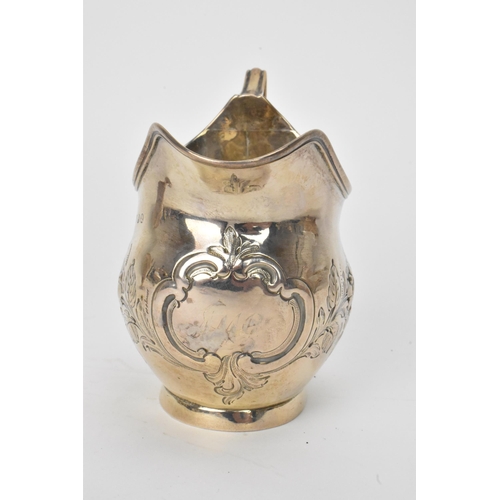 15 - A George III silver milk jug hallmarked London 1810, together with a Victorian silver cream jug hall... 