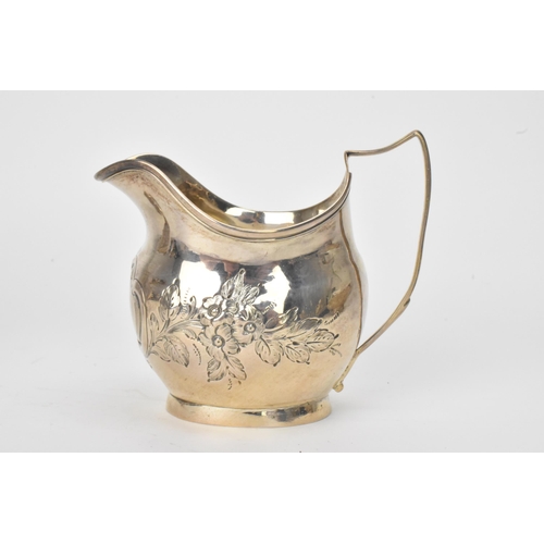 15 - A George III silver milk jug hallmarked London 1810, together with a Victorian silver cream jug hall... 