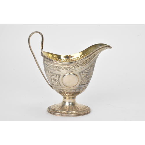 15 - A George III silver milk jug hallmarked London 1810, together with a Victorian silver cream jug hall... 