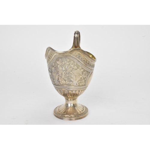 15 - A George III silver milk jug hallmarked London 1810, together with a Victorian silver cream jug hall... 