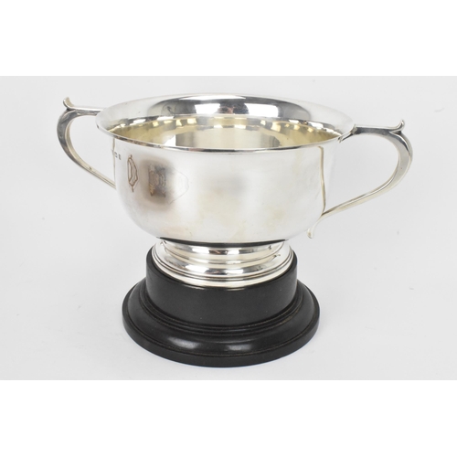 2 - A George V silver twin handled presentation bowl, Birmingham 1925, having a flared rim, engraved to ... 