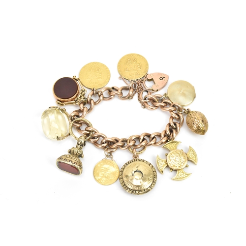 243 - A 9ct gold curb link charm bracelet, with various 9ct gold and yellow metal charms including a 9ct g... 