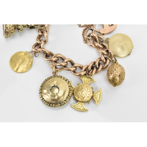 243 - A 9ct gold curb link charm bracelet, with various 9ct gold and yellow metal charms including a 9ct g... 