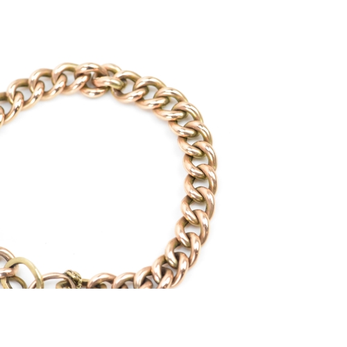 244 - A rose gold coloured curb link bracelet, with a safety chain and a 10ct gold hallmarked heart shaped... 