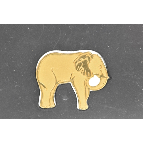 251 - A Johnson Mattey WWF model elephant made from 5 grams of 999.9 fine 24ct gold, mounted in a perspex ... 