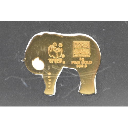 251 - A Johnson Mattey WWF model elephant made from 5 grams of 999.9 fine 24ct gold, mounted in a perspex ... 