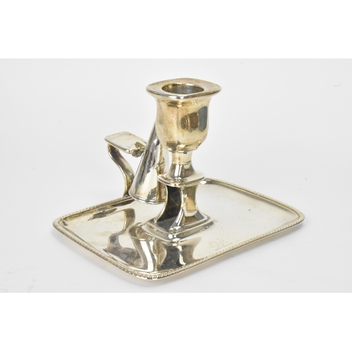 26 - A George III silver chamberstick, hallmarked London 1797, the candle snuffer hallmarked London 1796,... 