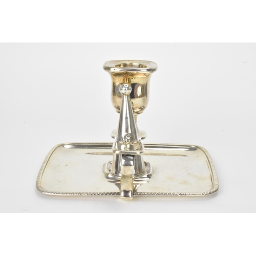 26 - A George III silver chamberstick, hallmarked London 1797, the candle snuffer hallmarked London 1796,... 