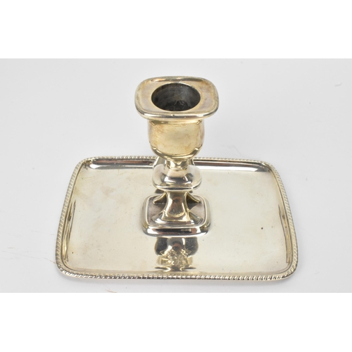 26 - A George III silver chamberstick, hallmarked London 1797, the candle snuffer hallmarked London 1796,... 