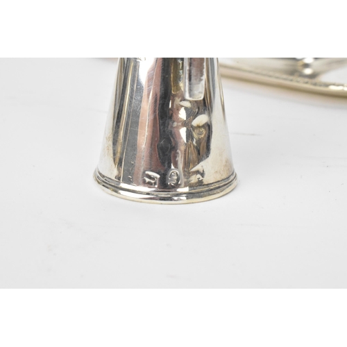 26 - A George III silver chamberstick, hallmarked London 1797, the candle snuffer hallmarked London 1796,... 