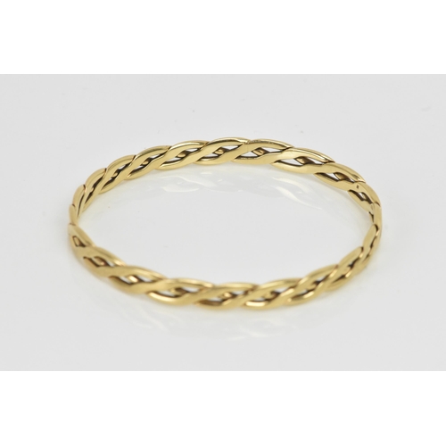 261 - A 9ct yellow gold bangle, of woven design, stamped 375, approx 22cm outer circumference, 18.9 grams