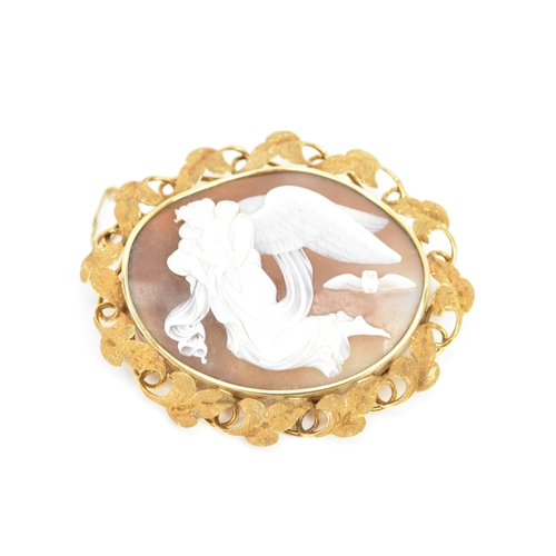 264 - A Victorian yellow metal cameo brooch, of oval form, the cameo depicting a guardian angel carrying t... 