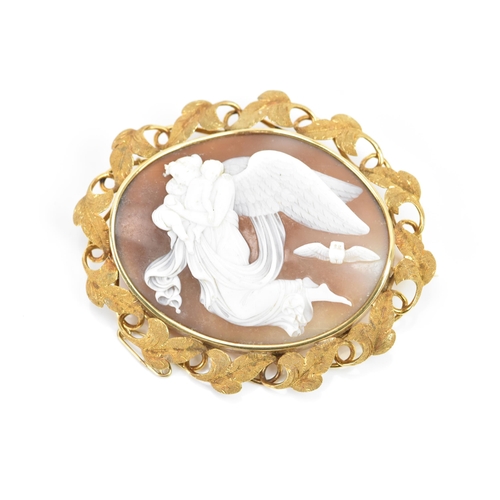 264 - A Victorian yellow metal cameo brooch, of oval form, the cameo depicting a guardian angel carrying t... 