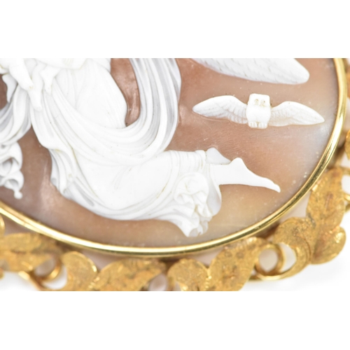 264 - A Victorian yellow metal cameo brooch, of oval form, the cameo depicting a guardian angel carrying t... 