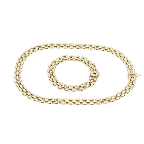 265 - A 9ct gold panther chain link necklace and matching bracelet, both with open box clasps, the necklac... 