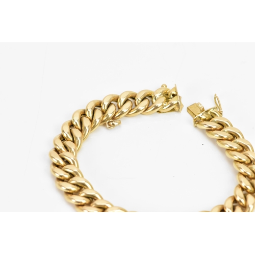 268 - A Yelloe gold curb chain link bracelet, tested as 14ct, with an open box clasp, 19cm, 22.4 grams