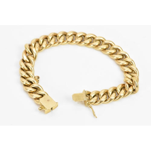 268 - A Yelloe gold curb chain link bracelet, tested as 14ct, with an open box clasp, 19cm, 22.4 grams