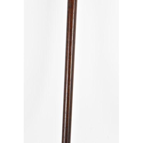 270 - A gold handled walking stick, tested as 14ct gold, the handle of reeded form and stamped G.O.P, on a... 