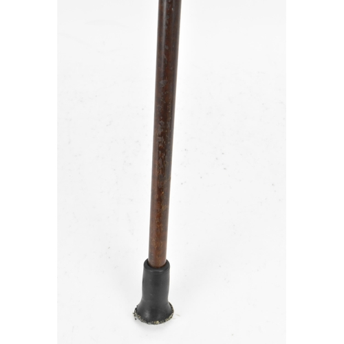 270 - A gold handled walking stick, tested as 14ct gold, the handle of reeded form and stamped G.O.P, on a... 