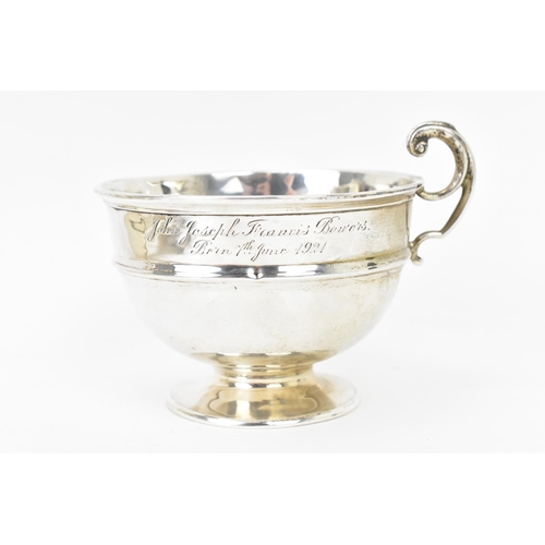 279 - A George V silver christening cup, makers marks rubbed, hallmarked Birmingham 1920, having a scroll ... 