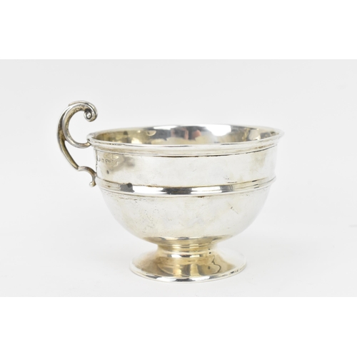 279 - A George V silver christening cup, makers marks rubbed, hallmarked Birmingham 1920, having a scroll ... 