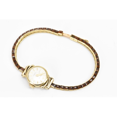 283 - A Cartier mid 20th century gold and Citrine line bracelet made into a watch strap and fitted to a la... 