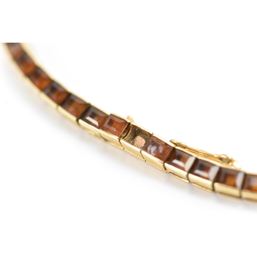 283 - A Cartier mid 20th century gold and Citrine line bracelet made into a watch strap and fitted to a la... 