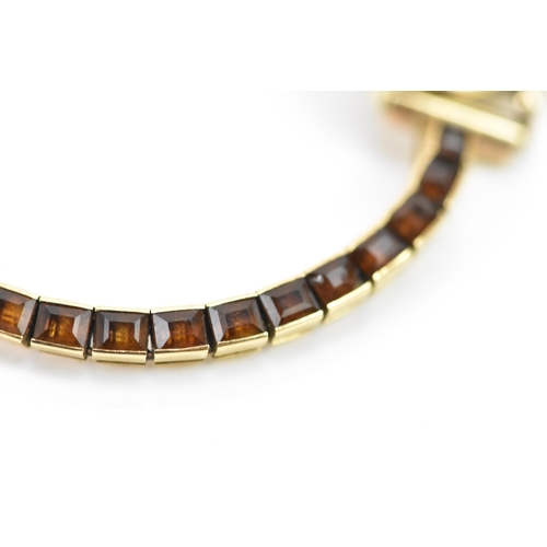 283 - A Cartier mid 20th century gold and Citrine line bracelet made into a watch strap and fitted to a la... 