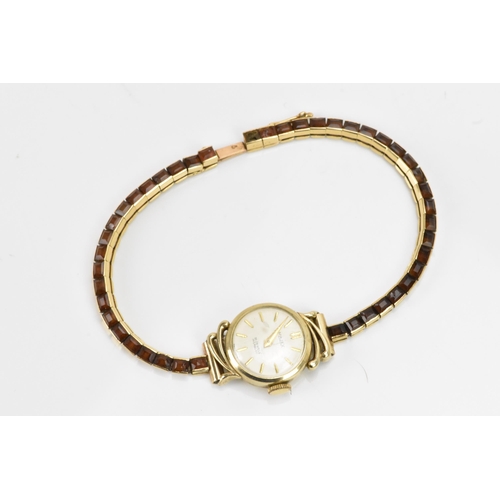 283 - A Cartier mid 20th century gold and Citrine line bracelet made into a watch strap and fitted to a la... 