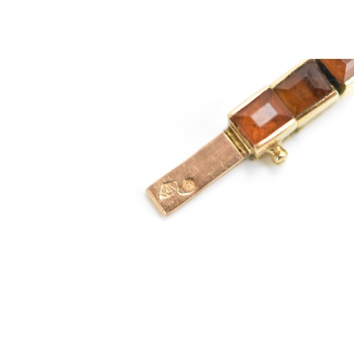 283 - A Cartier mid 20th century gold and Citrine line bracelet made into a watch strap and fitted to a la... 