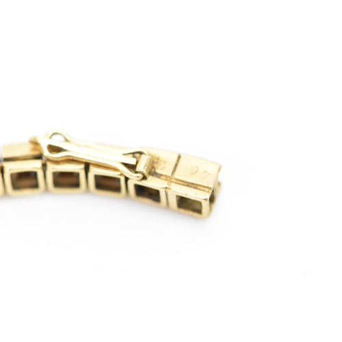 283 - A Cartier mid 20th century gold and Citrine line bracelet made into a watch strap and fitted to a la... 