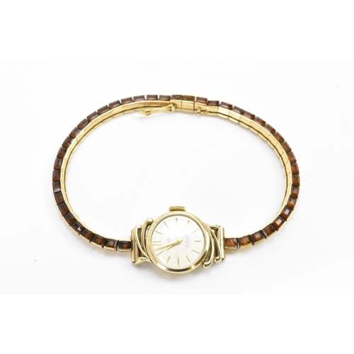 283 - A Cartier mid 20th century gold and Citrine line bracelet made into a watch strap and fitted to a la... 