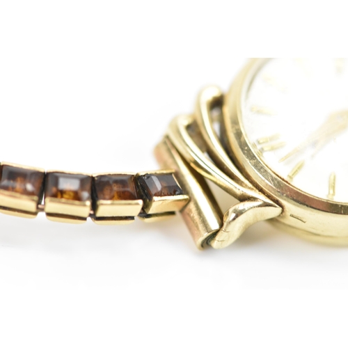 283 - A Cartier mid 20th century gold and Citrine line bracelet made into a watch strap and fitted to a la... 