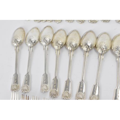 29 - A collection of Victorian cutlery in the fiddle, thread & shell pattern, with various dates and make... 