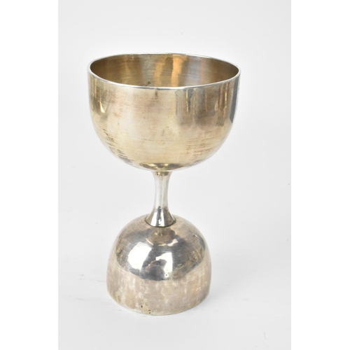 30 - An early 20th century white metal double ended measure, or a jigger, the double-ended drinks measure... 