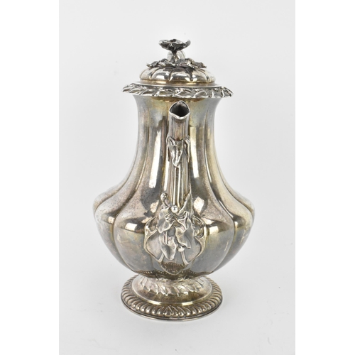 31 - A late 19th century Indian silver coffee pot, hallmarks for Calcutta 1860-1914, having a flower shap... 