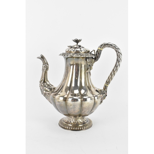 31 - A late 19th century Indian silver coffee pot, hallmarks for Calcutta 1860-1914, having a flower shap... 