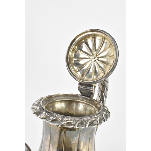 31 - A late 19th century Indian silver coffee pot, hallmarks for Calcutta 1860-1914, having a flower shap... 