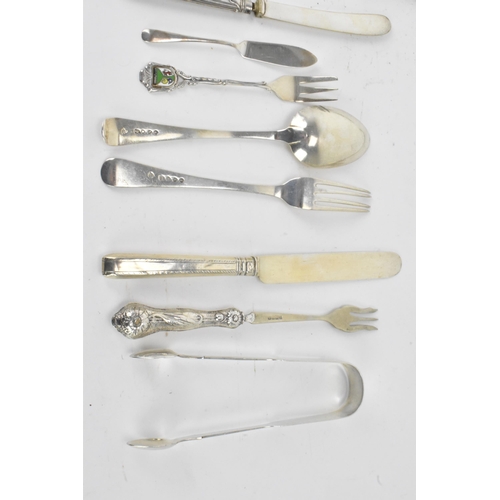 40 - A selection of various silver utensils with various dates and makers to include a Victorian cheese s... 