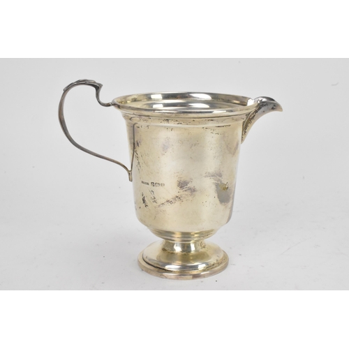 42 - A George VI silver matched four piece, comprising a teapot hallmarked Birmingham 1945, coffee pot, s... 