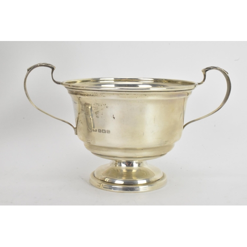 42 - A George VI silver matched four piece, comprising a teapot hallmarked Birmingham 1945, coffee pot, s... 