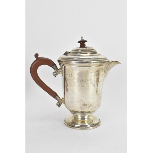 42 - A George VI silver matched four piece, comprising a teapot hallmarked Birmingham 1945, coffee pot, s... 