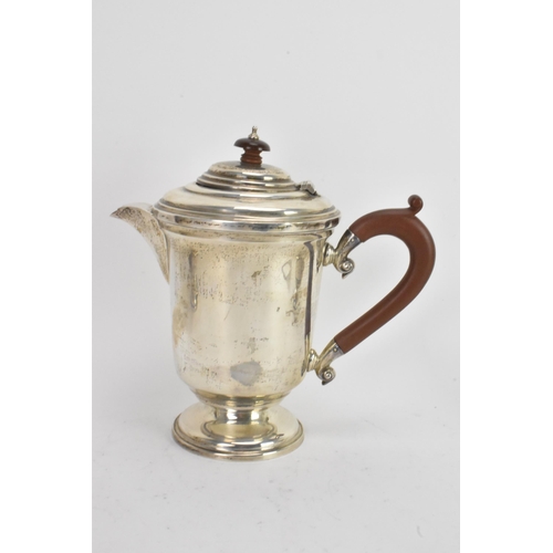 42 - A George VI silver matched four piece, comprising a teapot hallmarked Birmingham 1945, coffee pot, s... 