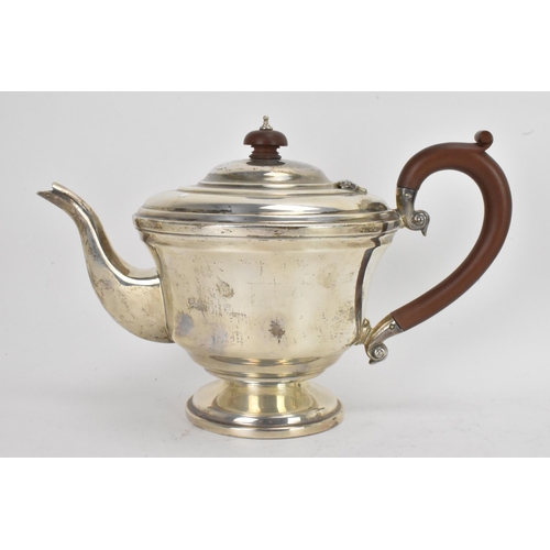 42 - A George VI silver matched four piece, comprising a teapot hallmarked Birmingham 1945, coffee pot, s... 