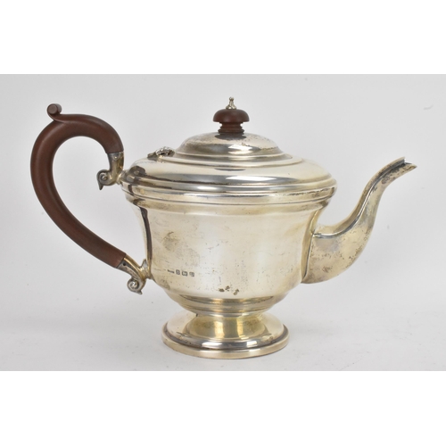 42 - A George VI silver matched four piece, comprising a teapot hallmarked Birmingham 1945, coffee pot, s... 