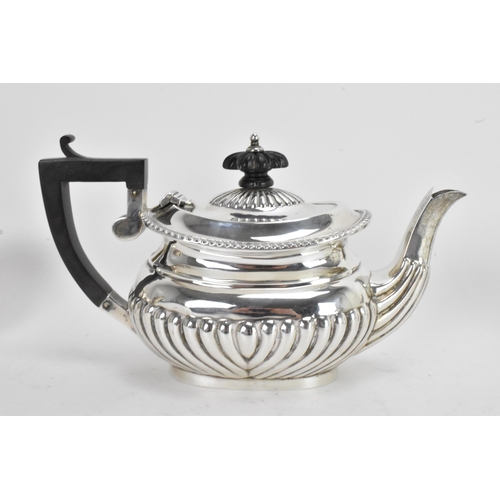 43 - An early 20th century silver 'Bachelors' three piece tea set, by Jones & Crompton, the teapot hallma... 