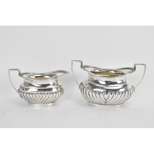 43 - An early 20th century silver 'Bachelors' three piece tea set, by Jones & Crompton, the teapot hallma... 